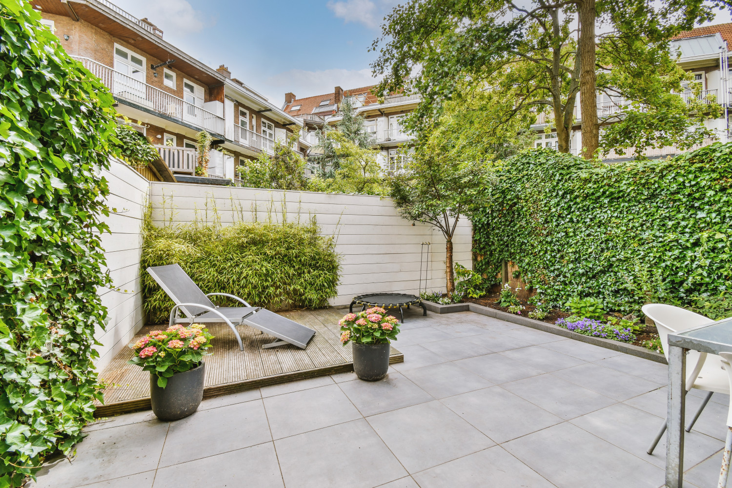 Neat,Paved,Patio,With,Sitting,Area,And,Small,Garden,Near