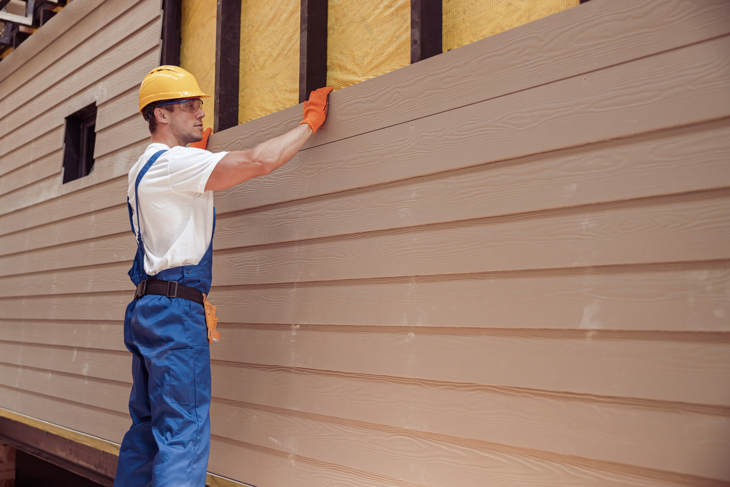 Male,Worker,Building,House,At,Construction,Site